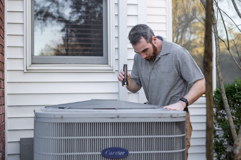 New AC unit being installed on a Florida home exterior